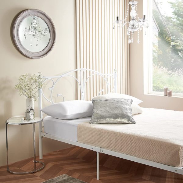 side of white metal bed