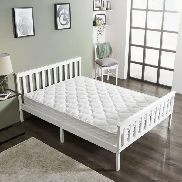 White wooden bed with mattress