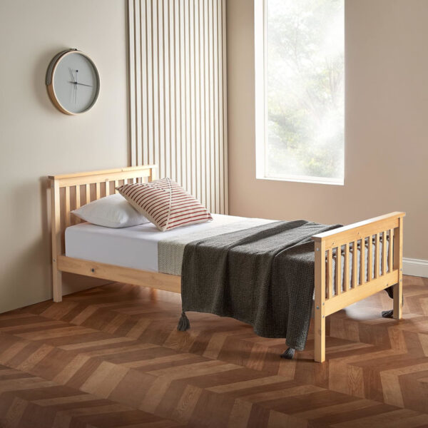 single pine wooden bed with mattress